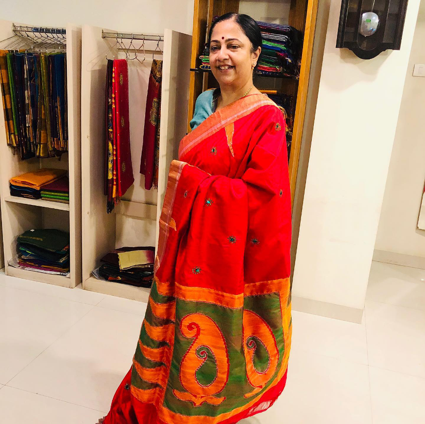 Red and green worki saree