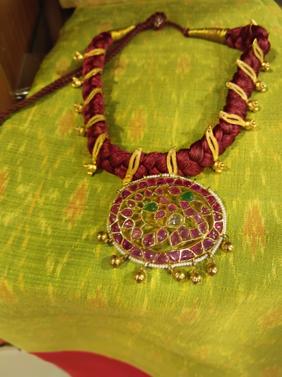 Jadau pendant uncut ruby on a twisted silk thread
