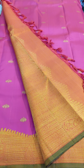 Uneven pyramid jacquard border with rich butte all over wedding saree